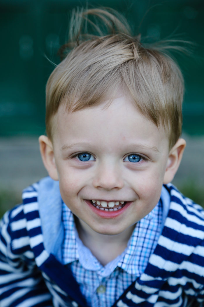 Little boy with blue eyes smiling